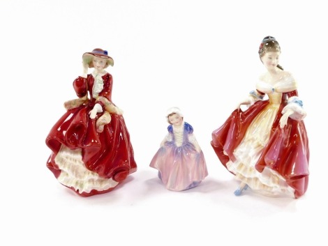 Three Royal Doulton porcelain figures, comprising Top O' The Hill. HN1834, Dinky Do. HN1678, and Southern Belle HN2229.