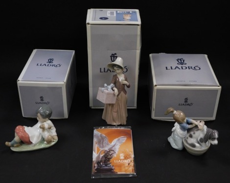 A Lladro porcelain figure of Bashful Bather, another figure Gone Shopping, and a figure of Taking Time, all boxed. (3)