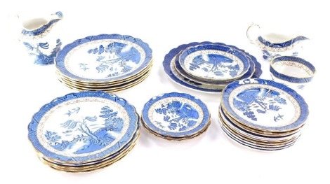 A Booths Real Old Willow pattern blue printed part dinner service, to include two jugs, dinner plates, etc. (a quantity)