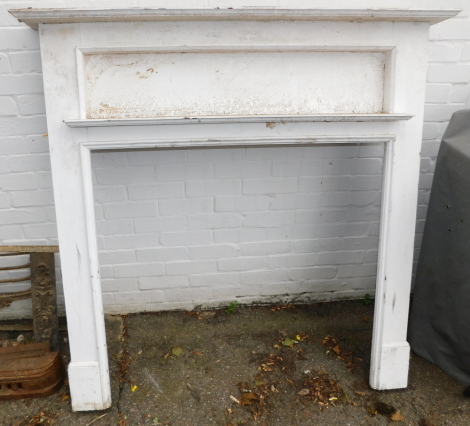 A white painted early 20thC fire surround with mantel, 139cm wide.