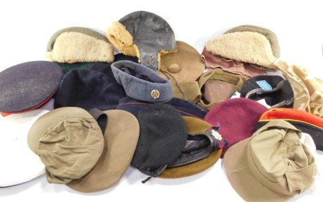 A collection of military hats, berets to include Brigadier's example., Scottish example, etc. (a quantity)