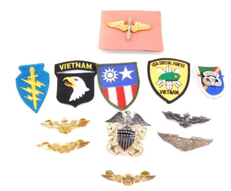 A collection of American military badges and Air Force Wings. (a quantity)