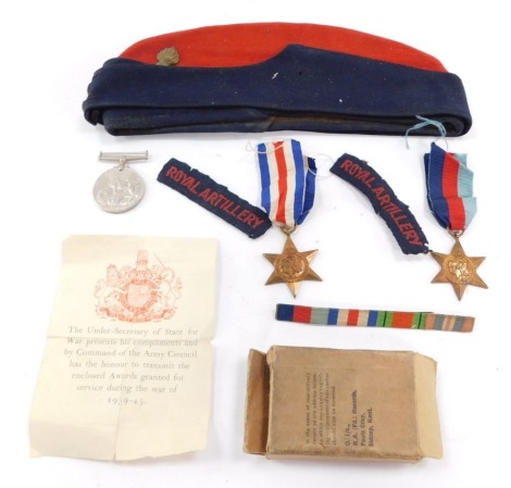 A WWII medal group, together with dress side cap, to The Royal Artillery, to include 1939-45 Star., France and Germany Star., Defence Medal, and War Medal, in original box.