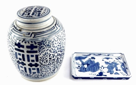 A Chinese Qing Dynasty blue and white ginger jar and cover, decorated in blue and white with symbols of happiness, peonies and scrolling leaves, 24cm high, together with a rectangular dish, decorated with figures in a garden, 21.5cm wide. (2)