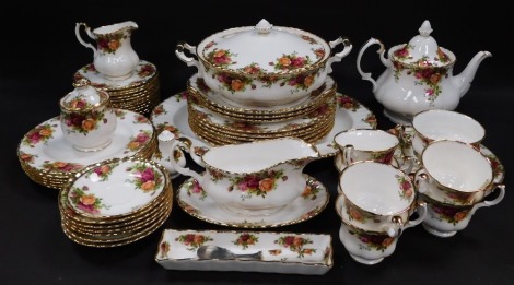 A Royal Albert porcelain part dinner and tea service decorated in the Old Country Roses pattern, comprising oval meat platter, vegetable tureen and cover, sauce boat on stand, salt and pepper, six dinner, dessert and side plates, teapot, two tier cake pla