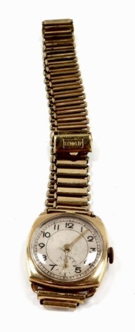 A gentleman's 9ct gold cased wristwatch, circular silver dial bearing Arabic numerals, subsidiary seconds dial, fifteen jeweled movement, on a plated strap.