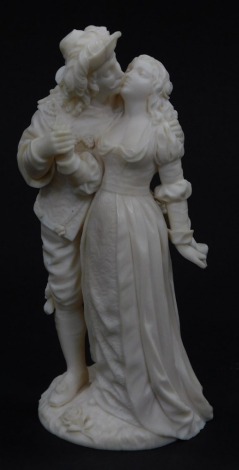 A Dieppe ivory 19thC carved figure pair of a seventeenth century courting couple, gallant and lady modelled standing on a naturalistic base, 12.5cm high.