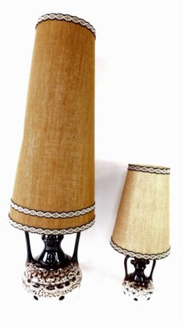 Two BHS lava style table lamps, each of twin handled form, with fabric shades.