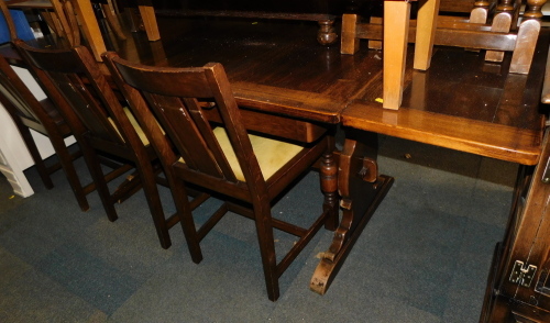 An oak draw leaf dining table, together with six chairs. (7)