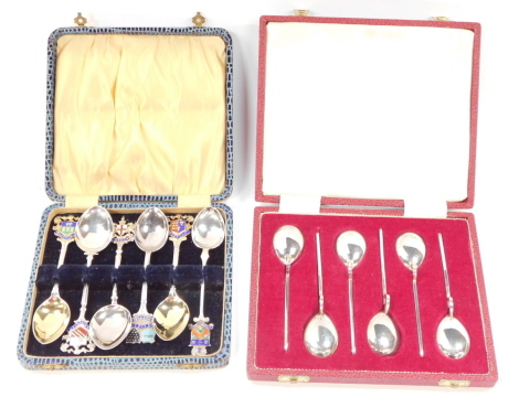 A set of six silver tea spoons, of 2nd Century AD Roman spoon form, cased, Sheffield 1978, together with six silver and enamel tea spoons, the terminals bearing armorials for the cities of London, Manchester, Sheffield, and Chester, and towns of Newquay a