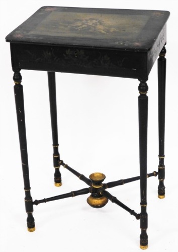 A 19thC French parcel gilt and ebonised work table, with en grisaille painted top of cherubs, and rose outer border, on X frame cross base, 69cm high, 45cm wide, 35cm deep.