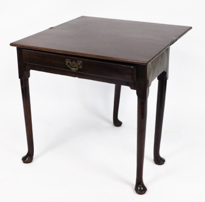 A George III mahogany side table, with fold over top and frieze drawer, on turned legs with pad feet, 71cm high, 75cm wide, 38cm deep. - 2