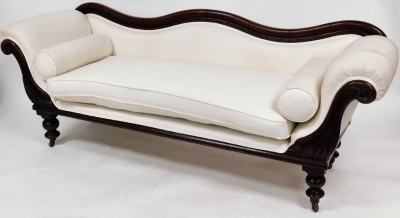 A Victorian mahogany framed sofa, with serpentine shaped moulded back, with carved scrolling arms on turned legs and casters, with loose seat cushions and re-upholstered in white woven material, 73cm high, 200cm wide, 60cm deep.