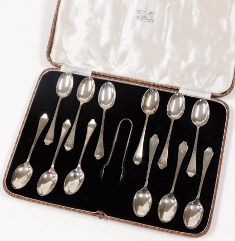 A George V cased set of silver teaspoons and sugar nips, each bearing the initial C, comprising twelve teaspoons and one set of sugar nips, Sheffield 1932, 5½oz, in a fitted Wallerman of Ayr box.