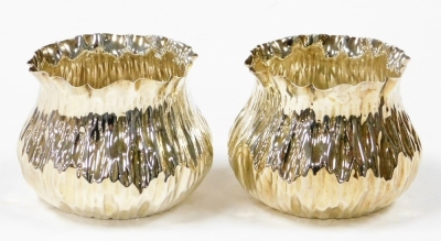 A pair of Victorian Arts & Crafts sugar bowls, each in the form of a pinched bag, London 1890, 7cm high, 7¾oz. (2)