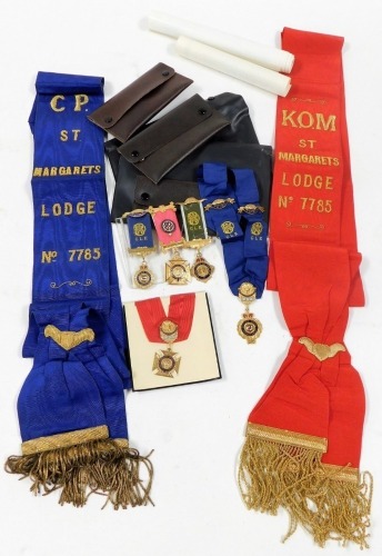 A group of Masonic memorabilia, comprising two induction certificates, red medal and sash, blue sash and medal, and three medals two for St Margaret's Lodge 7785, and another marked 2nd December 4-4-77, etc.