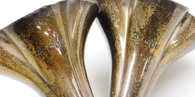 A pair of George V silver bud vases, each with fluted stem on a weighted base, London 1921, 14cm high, 15oz gross. - 2