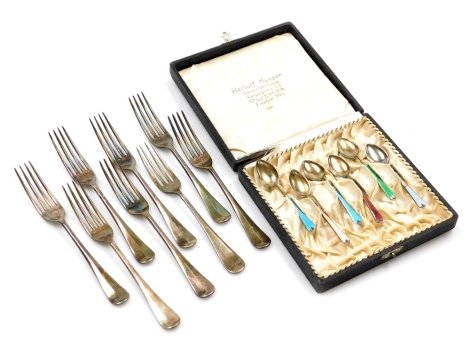 A group of cutlery, to include a set of six enamel teaspoons, each stamped 925 SR, in varying colours, in a Heruff Hanson box, 1½oz, together with a set of eight Fiddle pattern silver plated forks (AF).