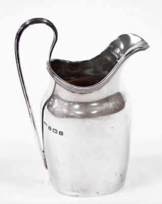 A George V silver cream jug, of Neo Classical design with loop handle, Birmingham 1929, 4¼oz.