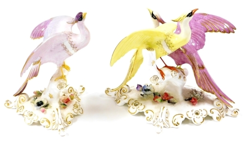 Two Royal Crown Derby bird figures, each with pink stamp to underside, to include the Chelsea Adira, 16cm high, and a twin group of Chelsea birds, 15cm high. (2)