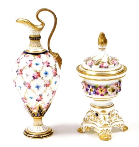 Derby porcelain, to include a Derby King Street Stevenson and Hancock pot pourri jar and cover with profuse floral decoration and gilt borders, circa 1863-1866, 15cm high, and a later Royal Crown Derby urn decorated with roses, 18cm high. (2)