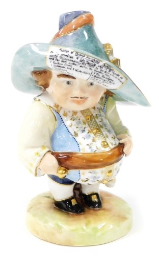 A Royal Crown Derby Mansion House dwarf, the hat bearing inscription for the auction of Elegant Household Furniture on the premises of John Humble, bears faint initials but rubbed, 18cm high.