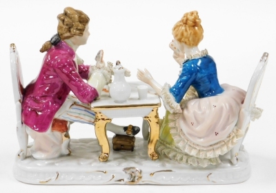 A Continental porcelain figure group, of card players in 18thC dress seated at a table, 26cm wide. - 2