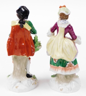 Two Continental porcelain figures, depicting a lady and gentleman each elaborately dressed, with encrusted flowers, with gold anchor mark to reverse, 24cm high. - 2