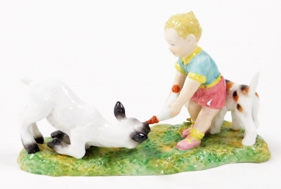 A Royal Crown Derby figure group, of a child feeding a lamb with dog, with red stamp to underside, 16cm wide. - 2