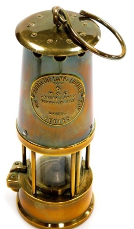 An Eccles miner's lamp, 23cm high.