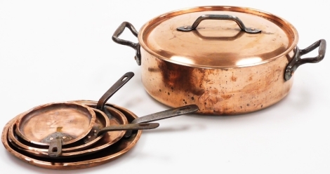 A Pierre Vergries copper pan and lid, together with a set of four graduated lids. (5)
