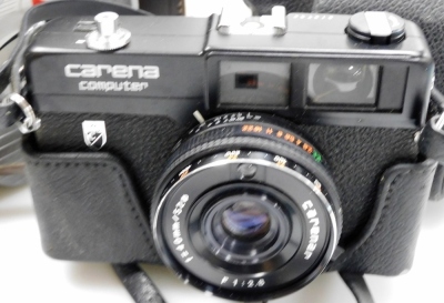 A group of camera equipment, to include a Pentax Optio S5I, Kodak box camera, a Keystone Electric Eye K-4C, a Carina Computer, a Nomo Cosmic Symbol and a Praktica Prinz Galaxy 1-4.5 lens. - 3