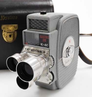 A group of camera equipment, to include a Pentax Optio S5I, Kodak box camera, a Keystone Electric Eye K-4C, a Carina Computer, a Nomo Cosmic Symbol and a Praktica Prinz Galaxy 1-4.5 lens. - 5