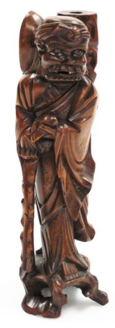 A carved hardwood figure of an Eastern gentleman, 30cm high.