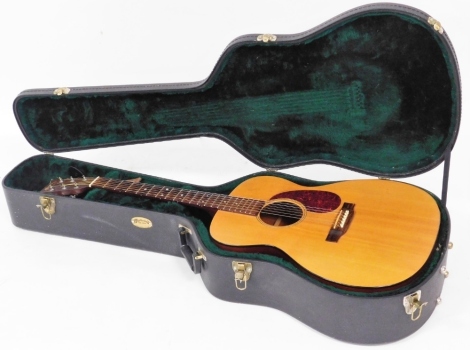 A Martin & Co mahogany jumbo acoustic guitar, in a fitted travel case with green lined interior, 115cm long.