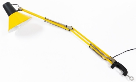 A table mounted angle poise lamp, in yellow, 93cm long.