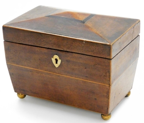 A 19thC mahogany tea caddy, with domed top, and a bone escutcheon, with fitted interior, on bun feet, 13cm high, 19cm wide, 11.5cm deep.