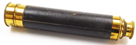 A brass two draw telescope, with lens cap in outer leather case.