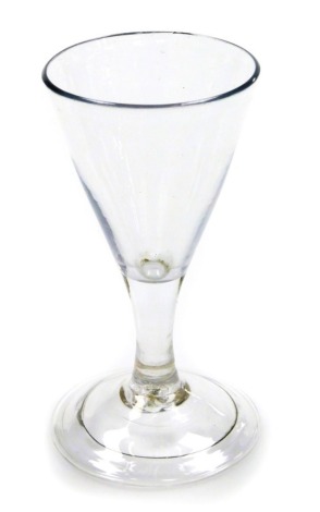 A 19thC firing glass, with domed folded foot and conical bowl, 12cm high. (AF)