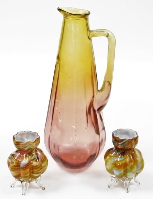 A group of Art Glass, to include a pair of flared vases, 12cm high, and a yellow and red water jug, 39cm high. (3)