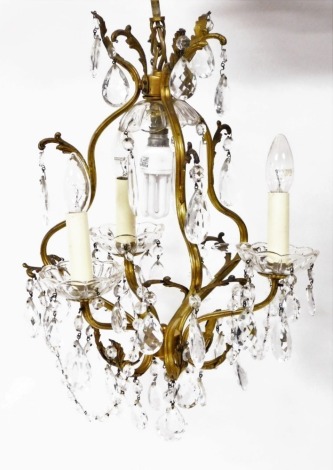 A gilt six branch crystal chandelier, 50cm high.