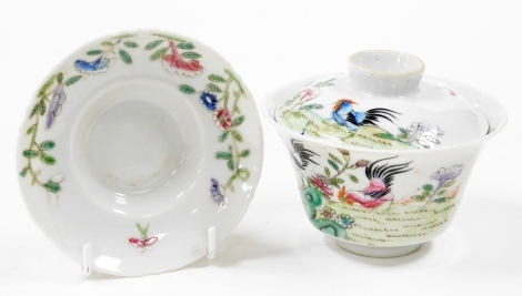 A Chinese porcelain rice bowl, with cover and stand decorated in cockerels, 7cm high.