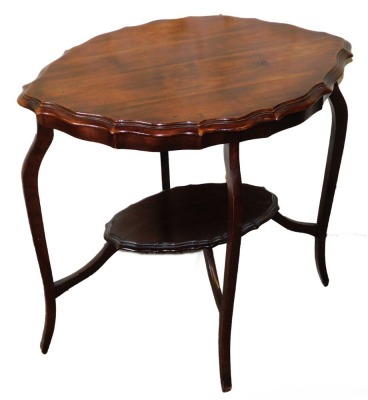 A Victorian walnut occasional table, with lozenge shaped top with piecrust border and under shelf, on splayed legs, 71cm high, 74cm wide.