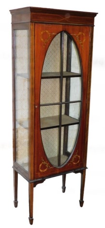 An Edwardian mahogany display cabinet, the tall cabinet with painted detailing of roses, with an oval glass pane split into four sections, on square taper legs, 171cm high, 60cm wide, 34cm deep.