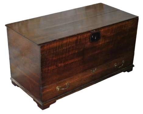 An 18thC oak mule chest, with lifted top above single drawer with brass handles, 53cm high, 102cm wide, 49cm deep.
