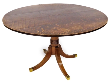 A 19thC and later oak and mahogany breakfast table, the top formed of oak panels, 123cm wide, on a much later mahogany base, with four splayed legs and brass castors, 69cm high.
