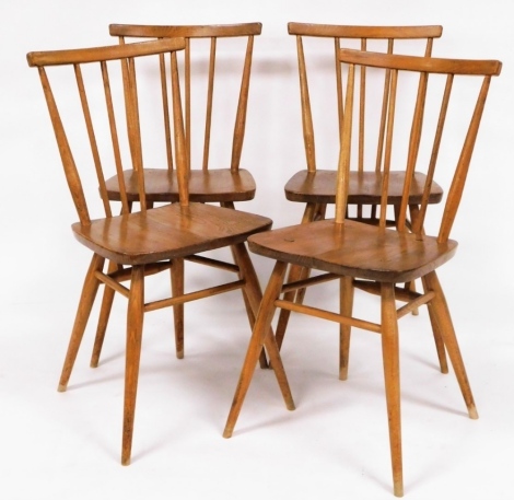 A set of four 1960's elm seated beech stick back kitchen chairs, stamped BS1960/HH2056.