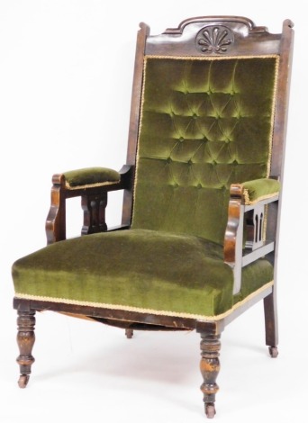 An Edwardian beech ladies salon chair, with a carved back and green draylon upholstery, 110cm high, 63cm wide, 63cm deep.