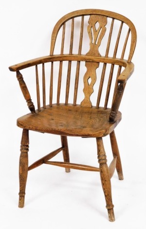 A 19thC ash and elm Windsor chair, with pierced splat, on H frame base, 85cm high, 59cm wide, 47cm deep.