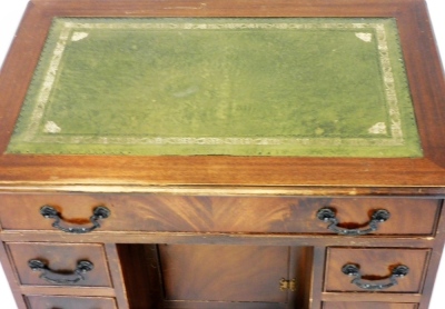 A mahogany kneehole desk, the rectangular top with green leather inset above one long drawer with three drawer pedestals, 74cm high, 76cm wide, 50cm deep. - 2